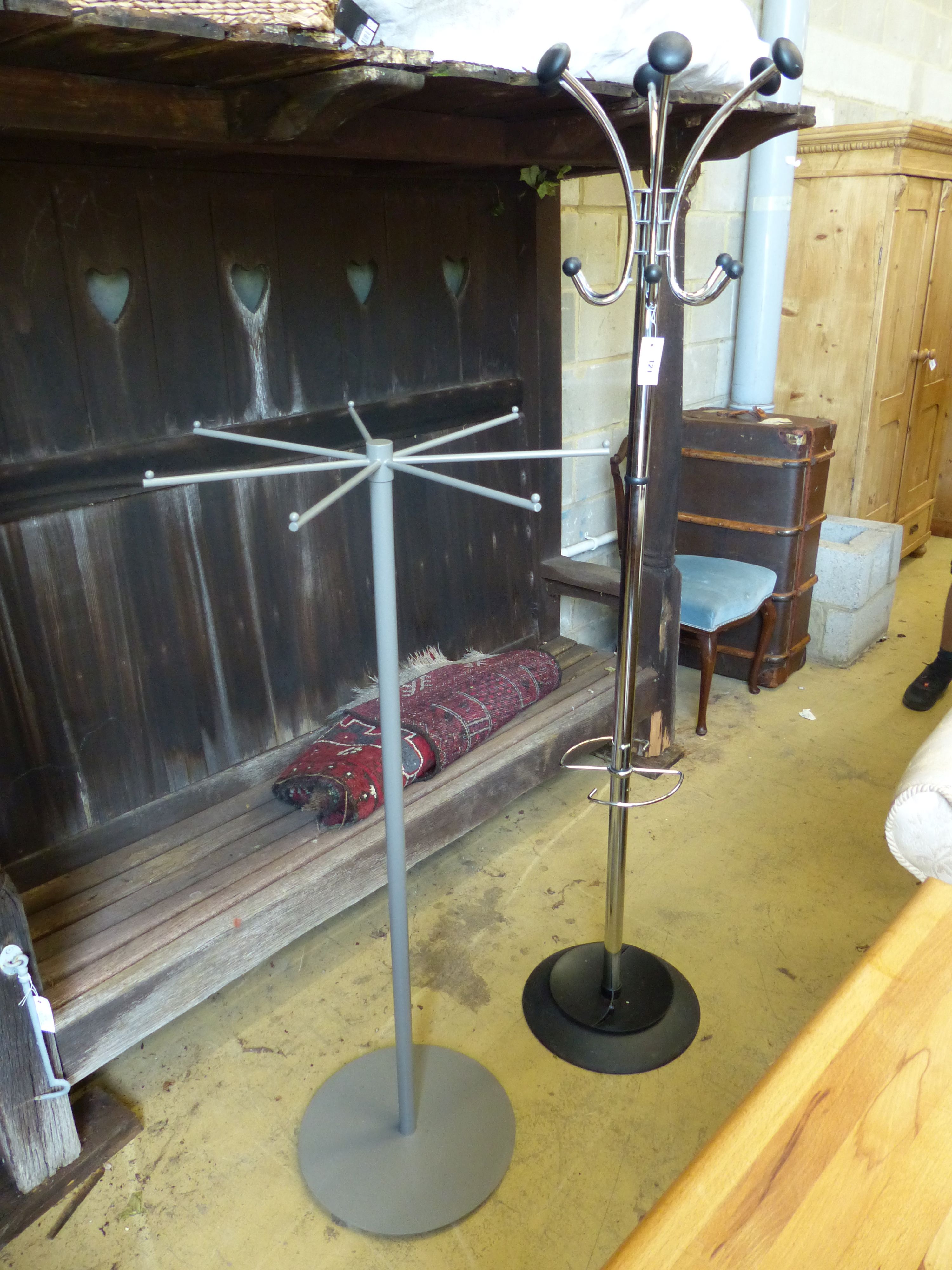 Two contemporary metal coat stands, larger 180cm high